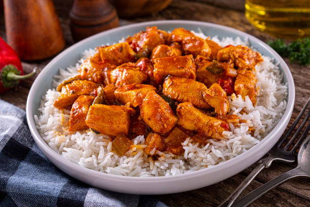 Creole Chicken A plate of delicious creole cajun style chicken with white rice. cajun food photos stock pictures, royalty-free photos & images