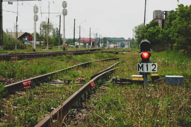 istock Red traffic light. Green natural railway background 1281682591