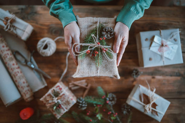 istock Cropped hands holding wrapped Christmas gift 1281682713