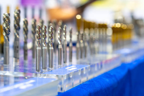 istock New and precision metal spiral or screw tapping cutting tools for threaded hole making in manufacturing process on table 1281682748
