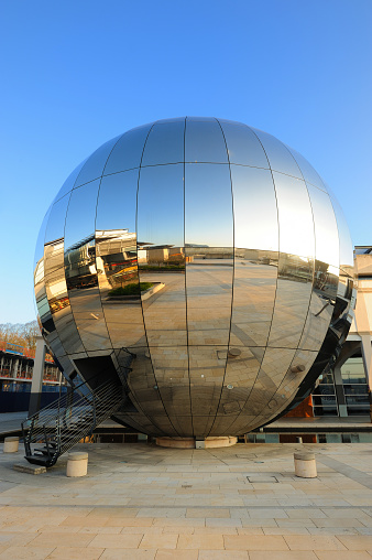 Bristol, England, UK - 23 March 2011: Giant mirror-ball in Bristol's Millennium Square is part of the city's science museum, known as Bristol Planetarium.