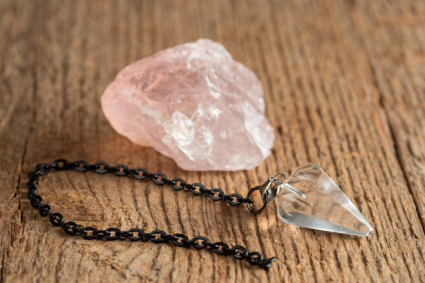 istock The pendulum on a chain with a natural crystal 1281685859