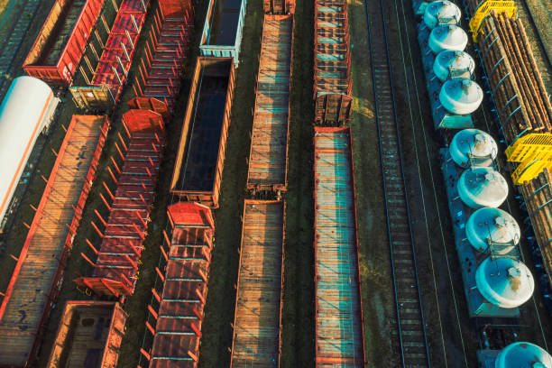 istock Freight wagons during morning sun light. Rail cargo transportation from above. 1281686125