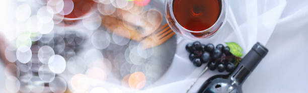 Glass with grape red semi-dry wine. Valentine's day concept background. Gift for the holiday. Sweet sparkling wine.