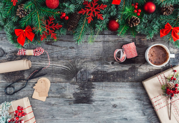 istock Christmas background with fir tree, decorations and gift boxes on wooden board with copy space 1281686318