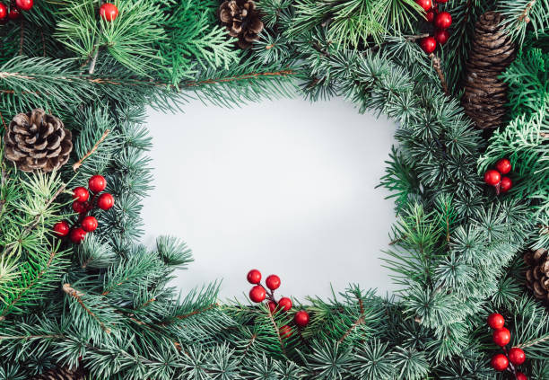 istock Blank paper, fir tree branches, red berries and pinecone. Christmas background 1281686325