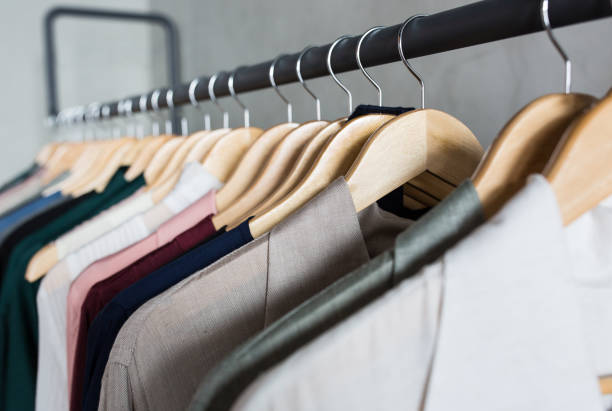 istock Collection clothes hanging on a clothing rack. 1281687635