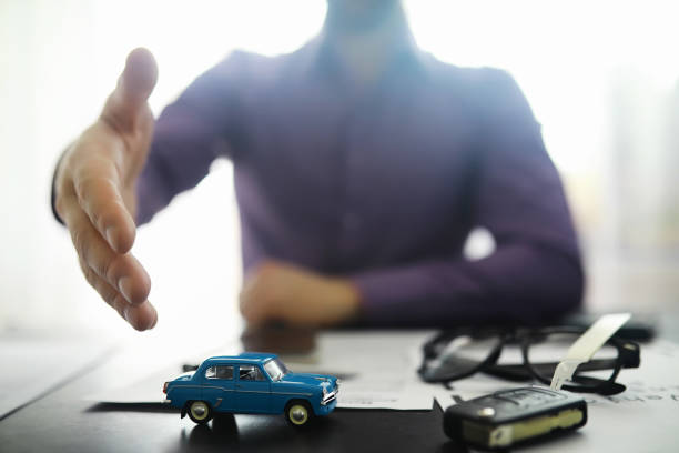 istock The insurance agent signs a document. Car insurance policy. Auto insurance policy. Forms for registration of the contract. 1281687853