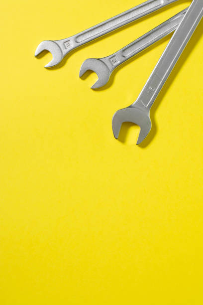 istock Wrenches on a yellow background. Hand tool. Top view with space for text 1281688658