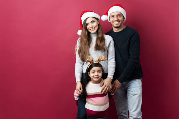 istock Family with santa's hats ready for Christmas 1281689086