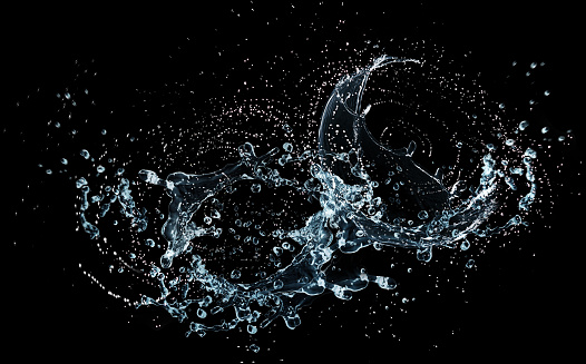 Water splash flying in the air isolated on black background