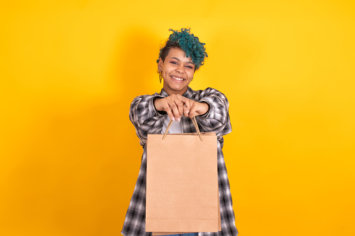 girl with shopping bags or stores isolated on color background