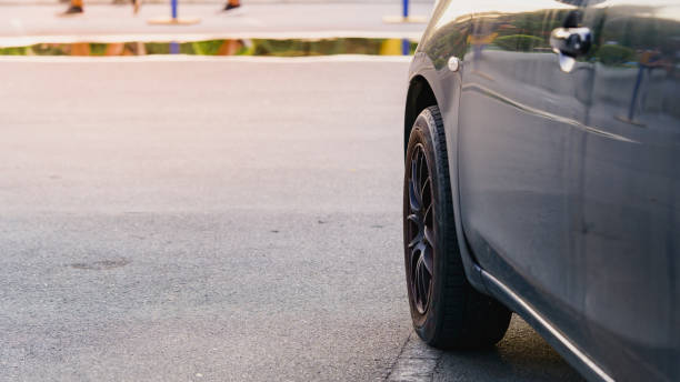 istock Black car side photo and soft focus background. 1281690440