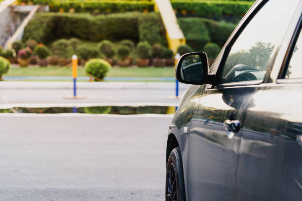 istock Black car side photo and soft focus background. 1281690482