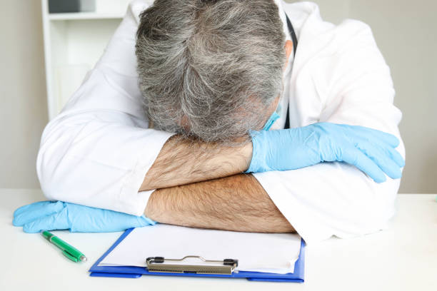 istock Shot of a doctor experiencing stress at work 1281692932