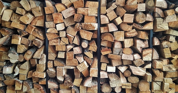 Stack of wood logs on shelf