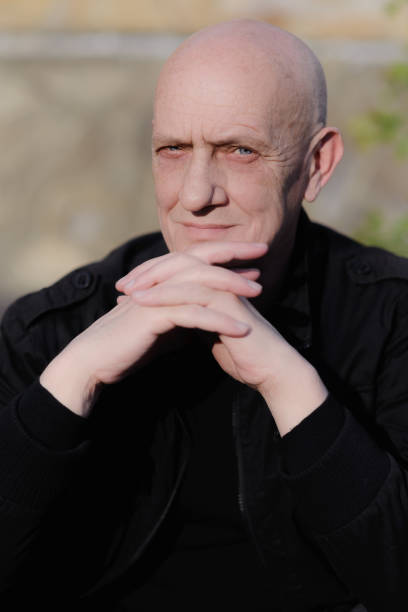 istock Senior bald man with blue eyes looking in the camera 1281695030