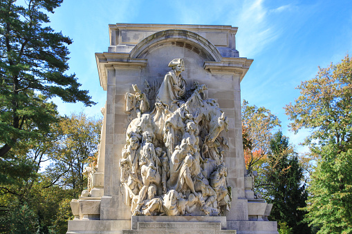 Princeton Battle Monument in Princeton, NJ, USA. The Monument commemorates the January 3, 1777 Battle of Princeton, and shows General George Washington leading his troops to victory. Sculptor Frederick MacMonnies is the author the monument. The architectural design was done by Thomas Hastings. The monument was made from Indiana Limestone and was completed in 1922.