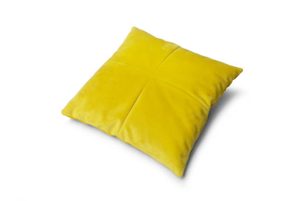 istock Soft yellow pillow isolated on white background 1281697260