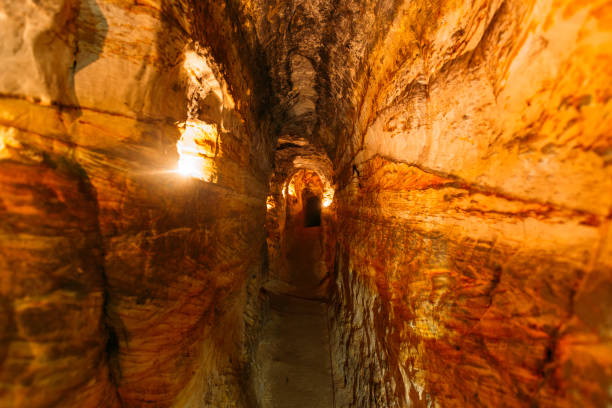 istock Ancient narrow underground passage in sandstone at old underground monastery 1281699788