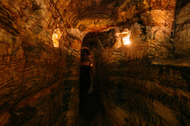 istock Ancient narrow underground passage in sandstone at old underground monastery 1281699801