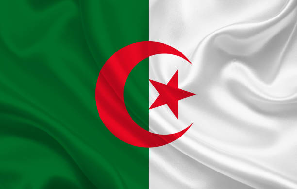 istock Algeria country flag on wavy silk fabric background 1281699978