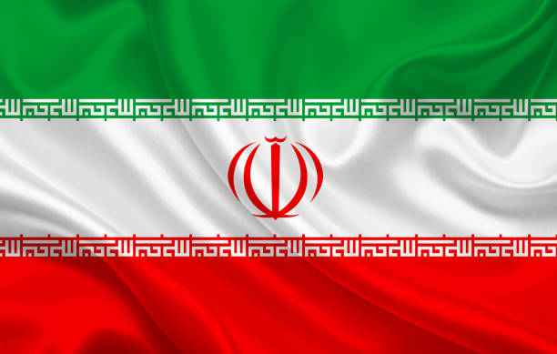 istock Iran country flag on wavy silk fabric background panorama 1281699999