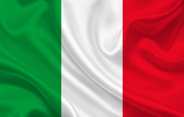 istock Italy flag on wavy silk fabric background panorama 1281700010