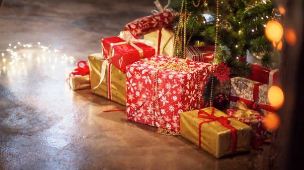 istock Blurred chrismas background with presents gifts lights 1281701911