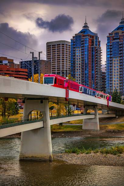 istock City Train Crossing The River Under Moody Clouds 1281702672