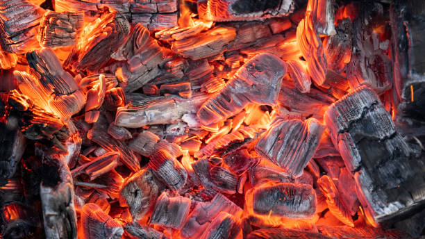 istock Hot coals are burning. Sparks from fire. 1281702970