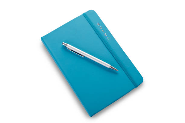 istock Aqua blue closed notebook isolated on white stock photo 1281704063