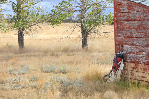istock Old Golf Clubs By Building on Great Plains 1281705207