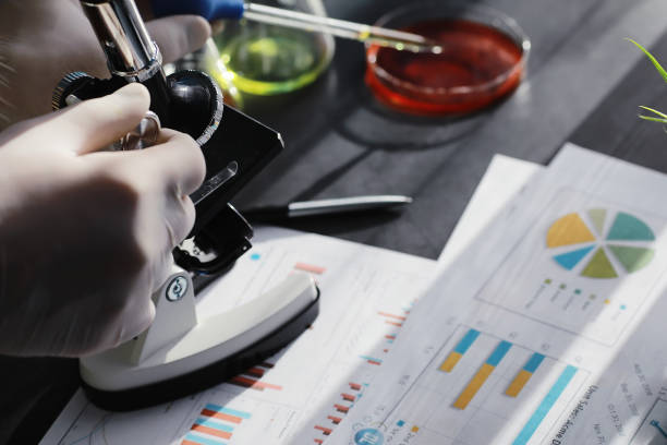 istock Laboratory research. Drug testing. Chemical experiments in the laboratory. Microscope various test tubes and beakers on the table at the medical officer. 1281705294