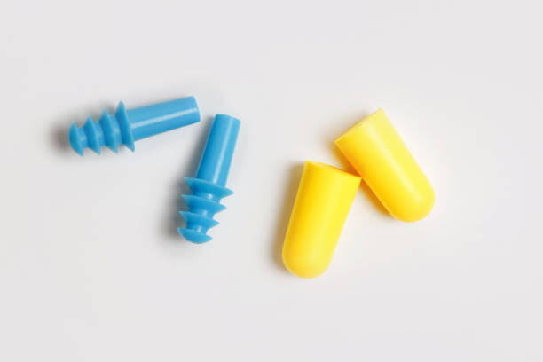 Two tipes of earplugs isolated on white Two tipes of earplugs isolated on white. Silicone and foam pairs polypropylene stock pictures, royalty-free photos & images