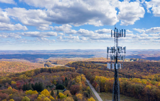 Cell phone or mobile service tower in forested area of West Virginia providing broadband service Aerial view of mobiel phone cell tower over forested rural area of West Virginia to illustrate lack of broadband internet service telecommunications equipment stock pictures, royalty-free photos & images