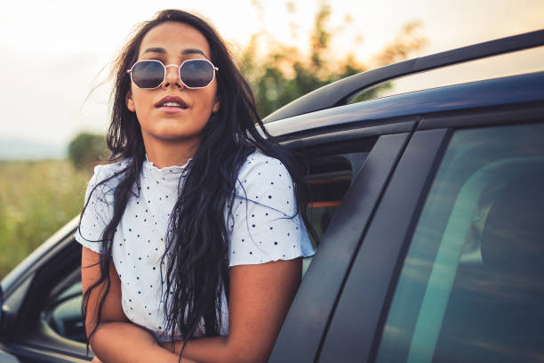 istock Beautiful female enjoying a car ride 1281711549