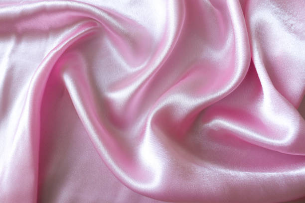 istock Smooth elegant pink silk or satin fabric background 1281711812