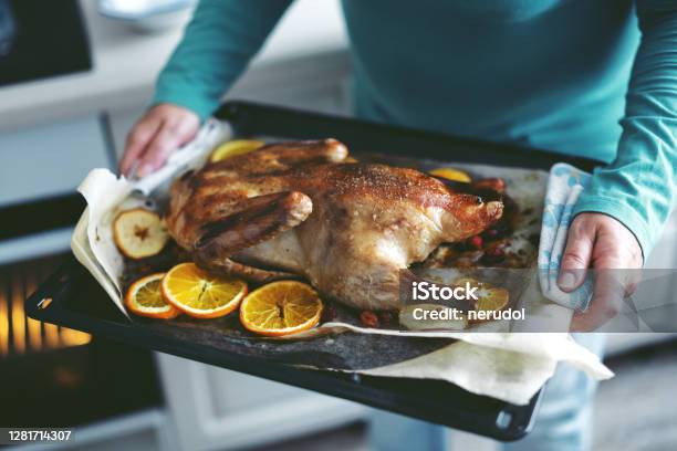 https://media.istockphoto.com/id/1281714307/photo/woman-cooking-duck-with-vegetables-and-puting-it-from-oven.jpg?s=612x612&w=is&k=20&c=rD3ti2xIHcMUDquUCzLPuWlD-9TrCl0woFcWa2ftc2I=
