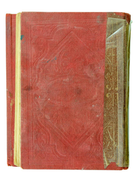 istock Old and worn down quran book top view, isolated on white background. Textured red hardcover, blank surface. 1281715982