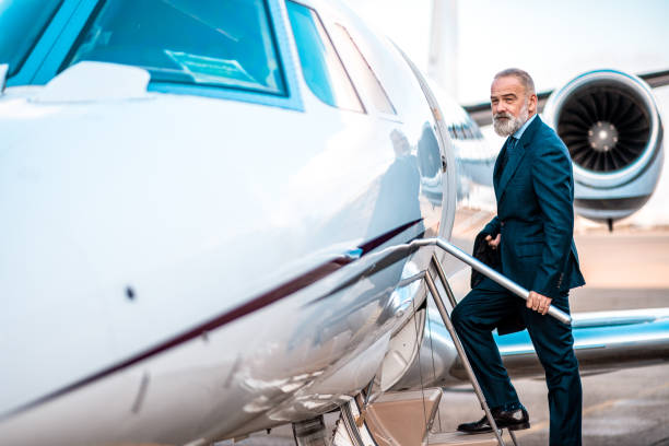 istock Businessman entering the private jet 1281717616