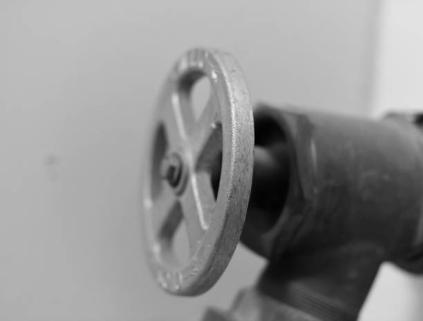 Fire extinguishing equipment, a hydrant tap in black and white.