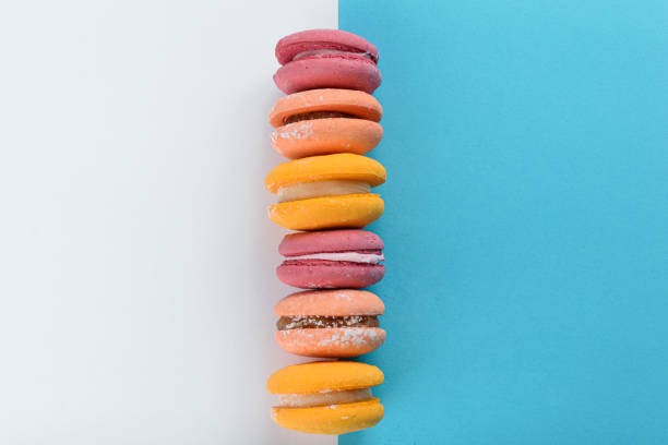 istock Macaroons arranged and lined up on a blue and white background. 1281719968
