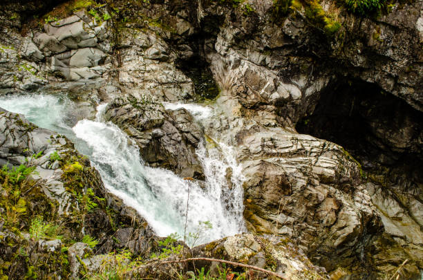 istock Upper Qualicum Falls - At the top of the rocks the falls begin 1281721187