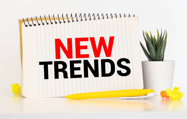 istock New Trends text written on notebook with glasses, magnifier end pen. 1281723099