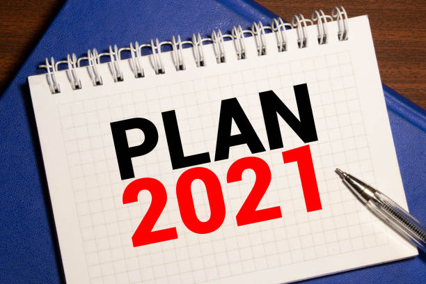 istock Plan 2021 words written in an office notebook. Concept in business. 1281723107
