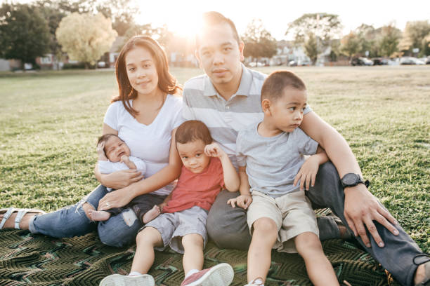 istock Family with three kids having fun 1281725450