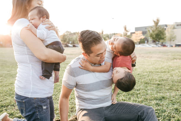 istock Family with three kids having fun 1281725464