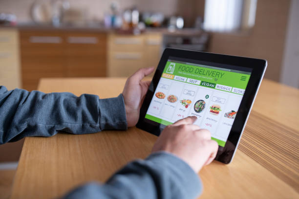 istock Woman ordering food online with digital tablet. 1281725561