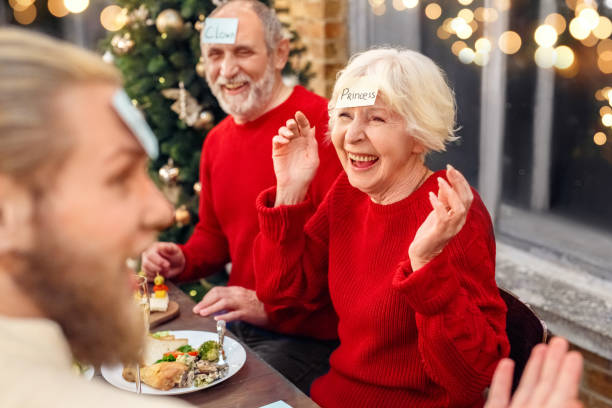Grandmother with memo on forehead playing in game